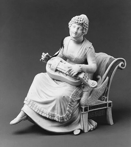 Woman playing a hurdy-gurdy — Unknown