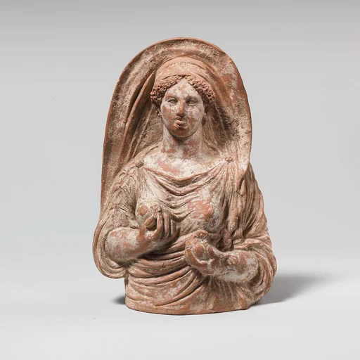 Terracotta mask of woman to hips