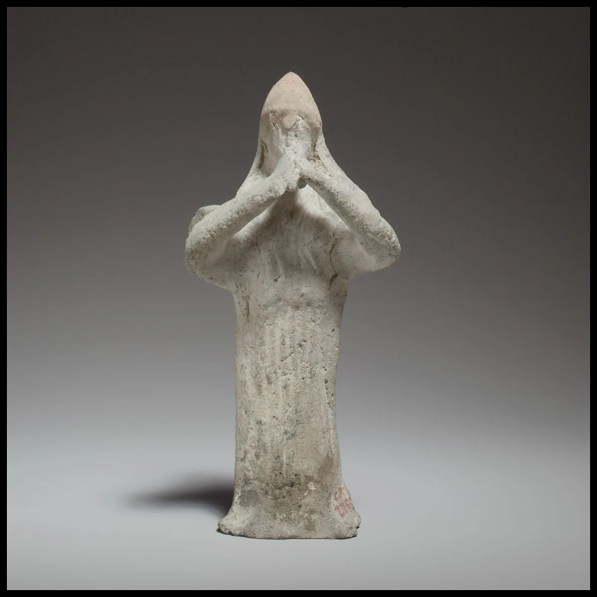 Standing female flute player — Unknown