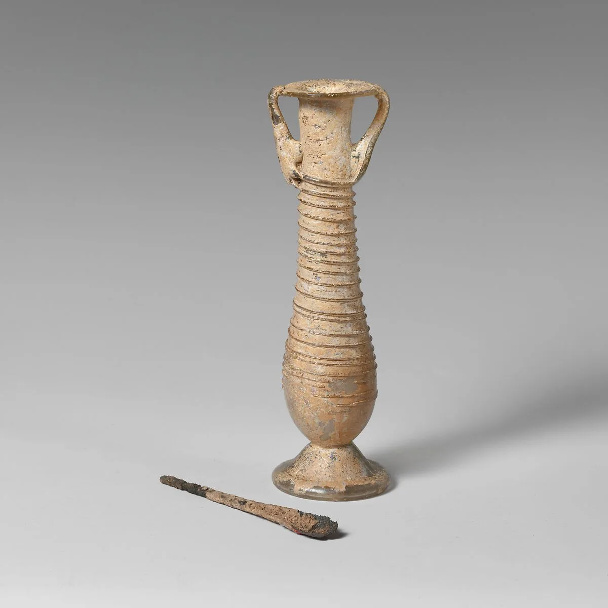 Glass cosmetic flask (kohl tube) — Unknown