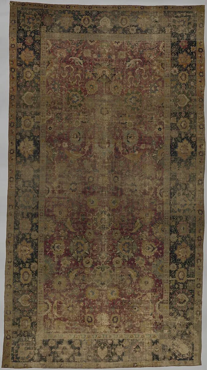Indo-Persian carpet with vine scroll and palmette pattern — Unknown