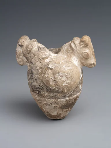 Mace head with reclining bulls