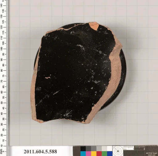 Terracotta fragment of a stemless kylix (drinking cup)