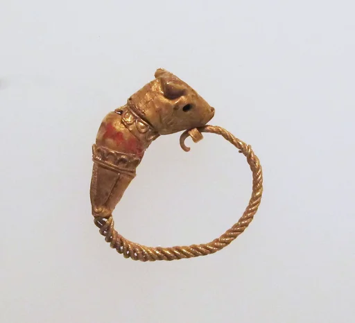 Gold earring with head of a bull