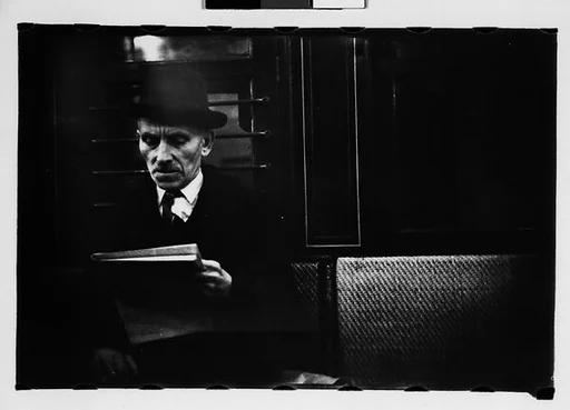 [Five 35mm Film Frames: Subway Passengers, New York City: Man in Hat Reading Newspaper, Man in Hat, Woman]
