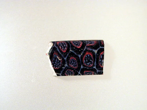 Glass mosaic carinated bowl fragment