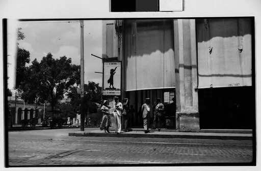 [Street Scene with Pedestrians Under Symphony Poster, Havana]