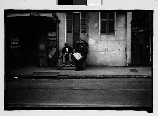 [Men Seated on Stoop in French Quarter Doorway, New Orleans, Louisiana]
