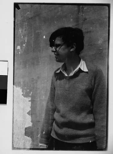 [Woman in Sweater and Horn-Rimmed Glasses]