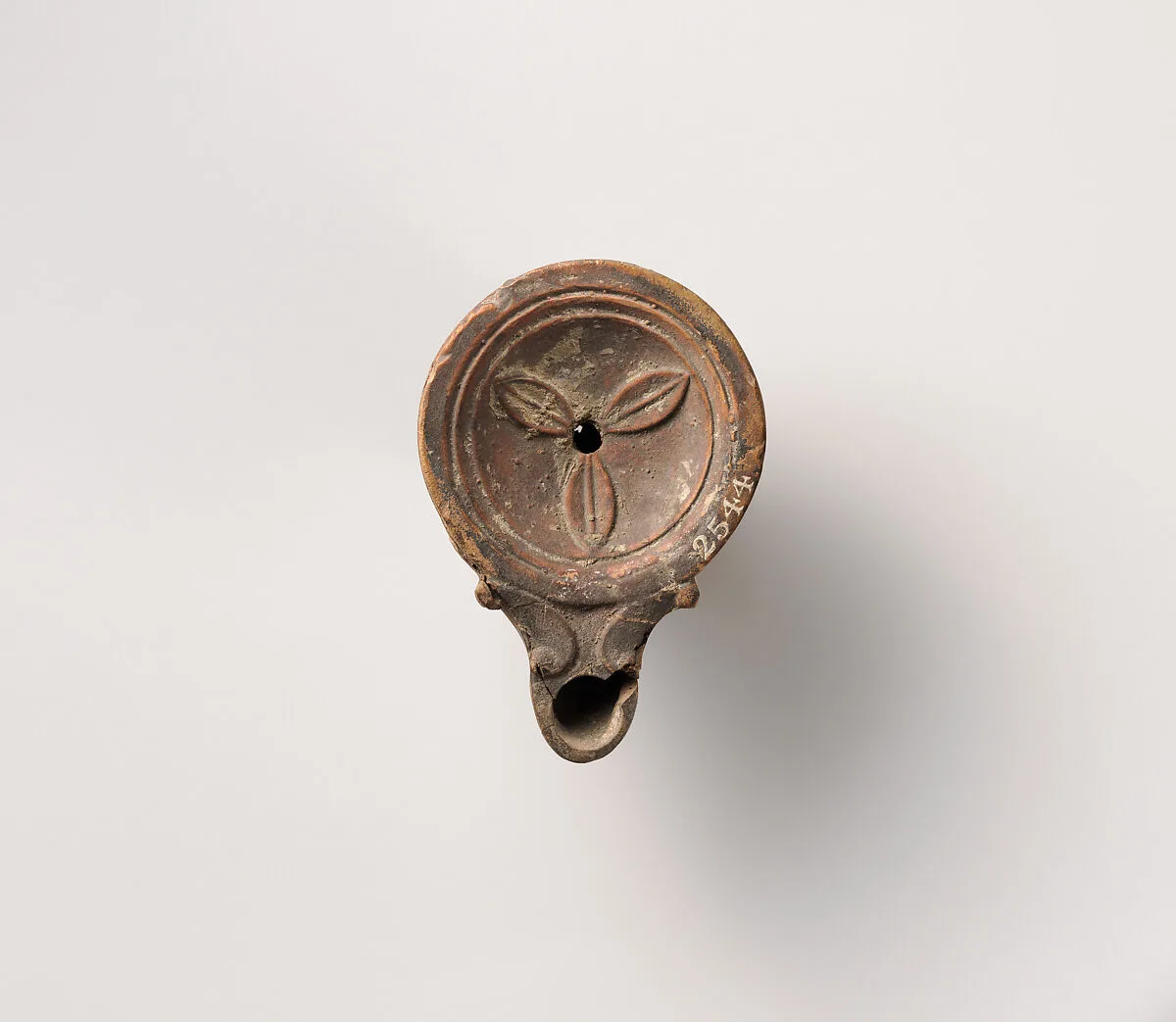 Terracotta oil lamp — Unknown