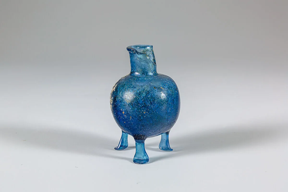 Glass bottle with three feet — Unknown