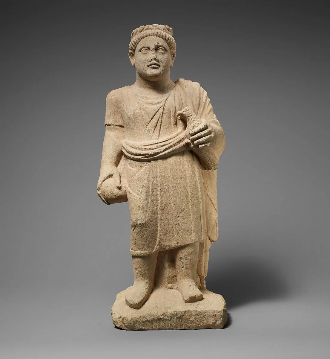 Limestone statuette of a boy with a wreath of leaves — Unknown