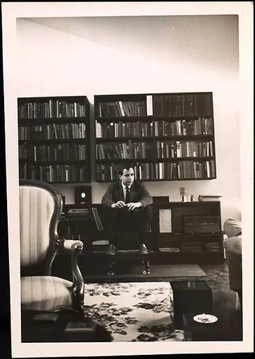 [Ben Schultz Seated in Walker Evans' Living Room and Library, Old Lyme, Connecticut]
