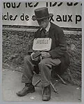 Blind Man in front of Billboard, Paris — Lisette Model