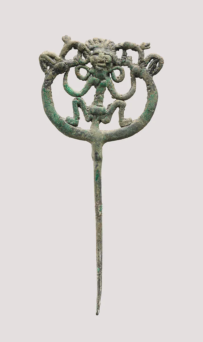 Openwork pin with a squatting female — Unknown
