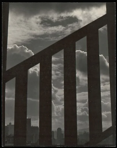 [City Skyline Seen Through Railing]