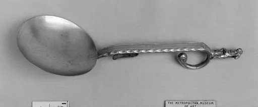 Figure-top spoon