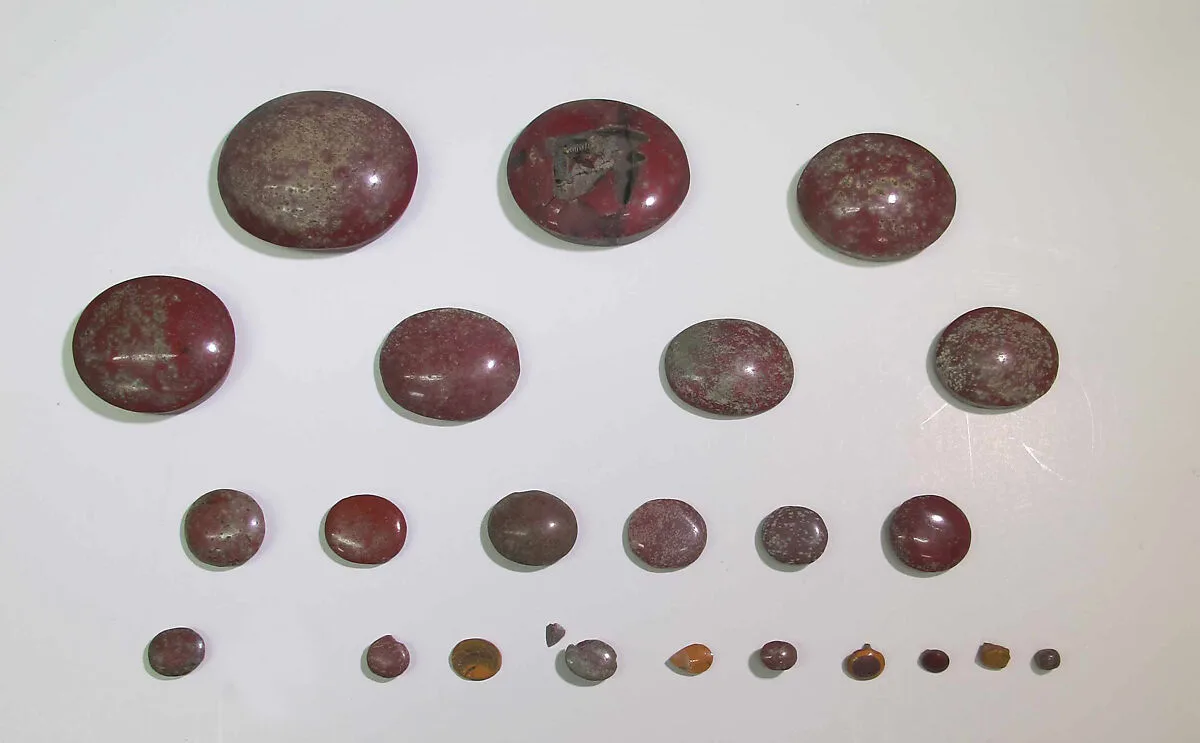 Inlays from shrine: rounded discs, one with cell for a wedjat — Unknown
