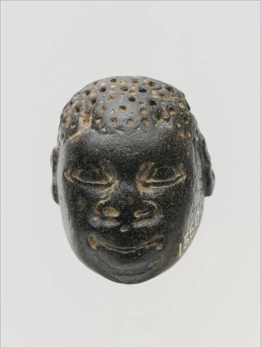 Chlorite pendant in the form of the head of a Black African — Unknown