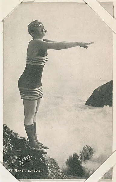 Bathing beauty poised to dive off rock from Mack Sennett Comedies Arcade series (W423) — Unknown