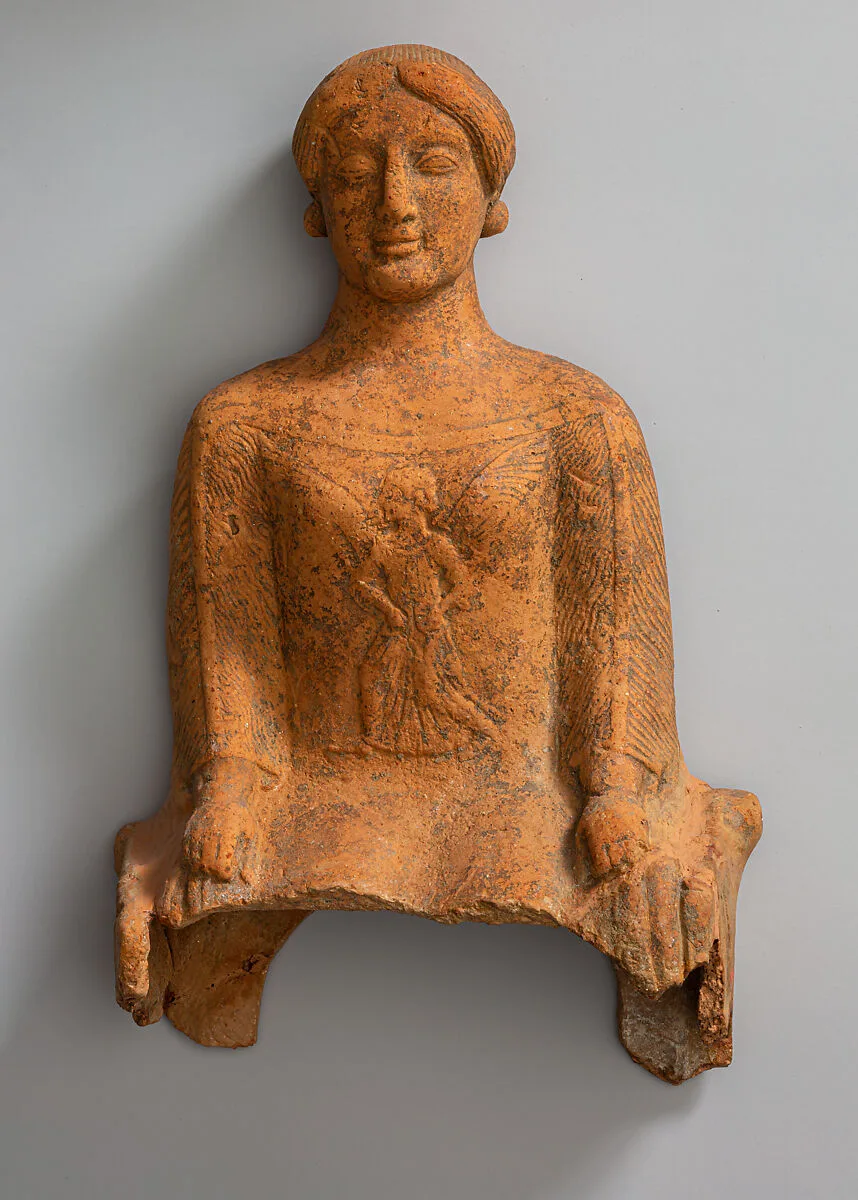 Terracotta figure of a seated woman — Unknown