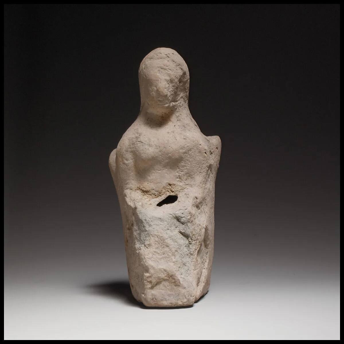 Seated female figurine — Unknown