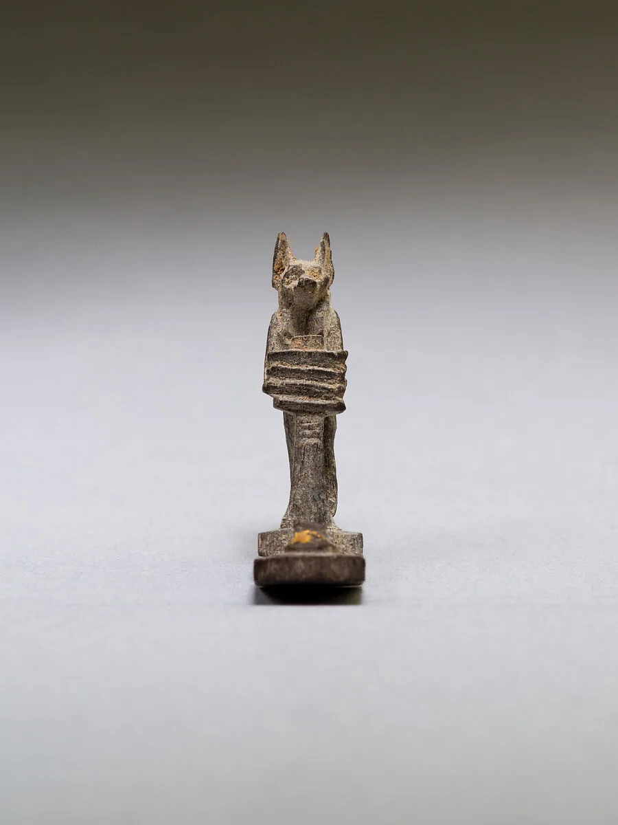 Anubis (?) supporting a large djed pillar — Unknown