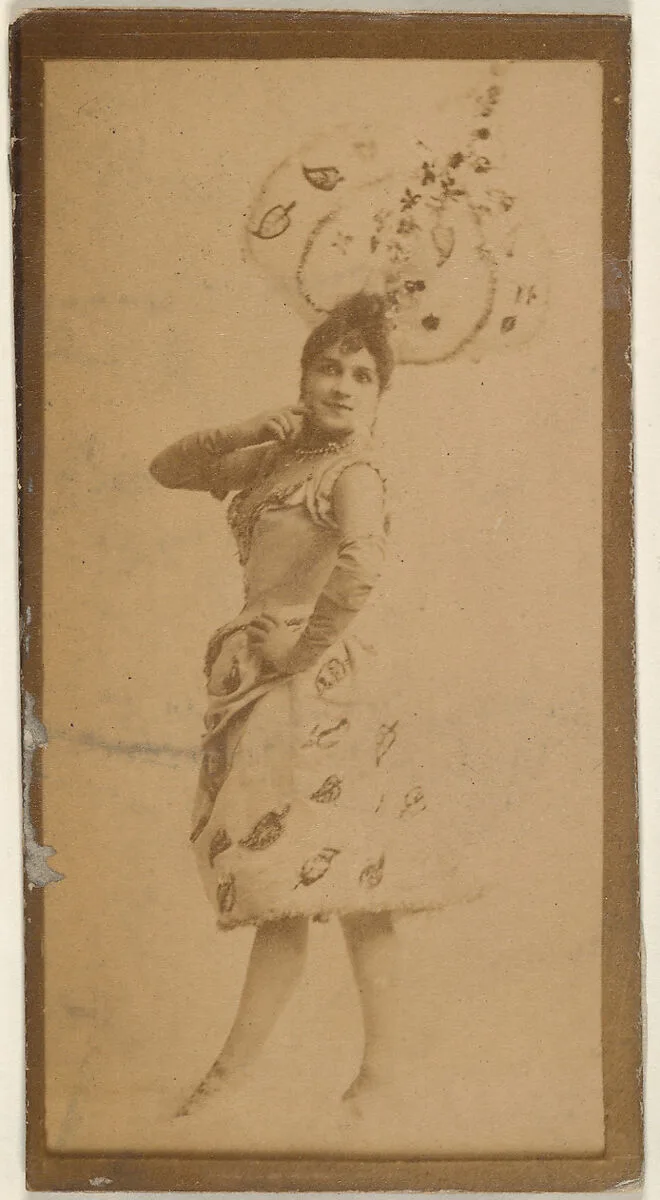Actress wearing costume with elaborate headpiece, from the Actresses series (N668) — Unknown