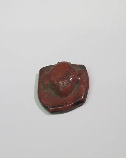 Mold-pressed amulet or fragment
