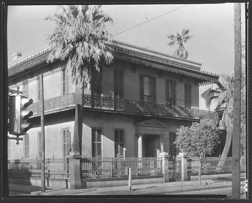 [Stone Town House with Cast-Iron Balconies and Fence in French Quarter, Esplanade Avenue, New Orleans, Louisiana]