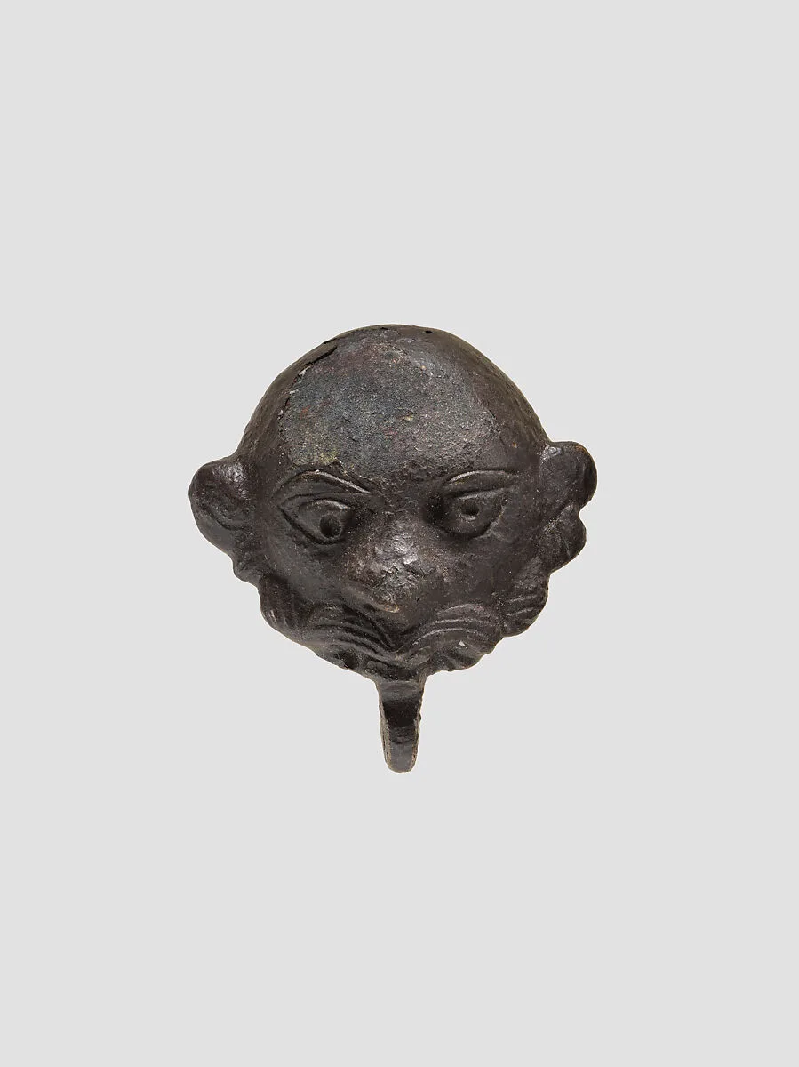 Cover in the form of a man's head — Unknown