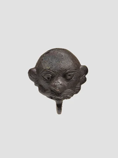 Cover in the form of a man's head