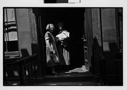 [Two 35mm Film Frames: Two Old Women in Doorway, Old Woman on Sidewalk, New York City]