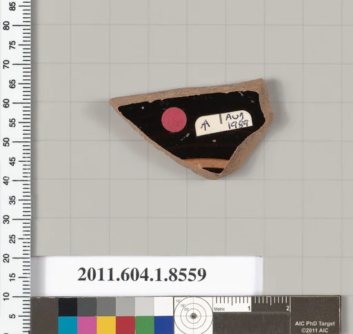 Terracotta fragment of a stemless kylix (drinking cup)