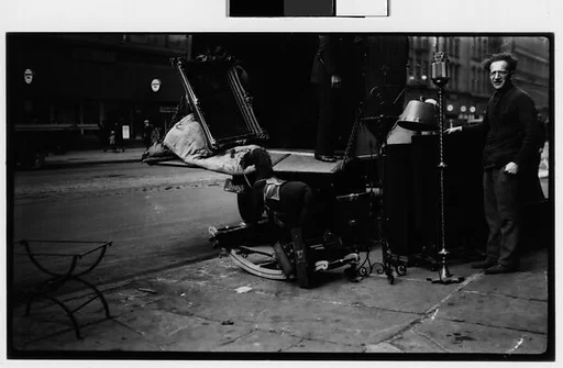 [Open Cab of Moving Truck on Street with Mirror, Hobby Horse, and Man in Foreground, New York City]