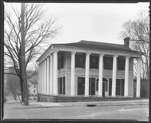 [Greek Revival House with Full-Façade Porch and Ionic Capitals]
