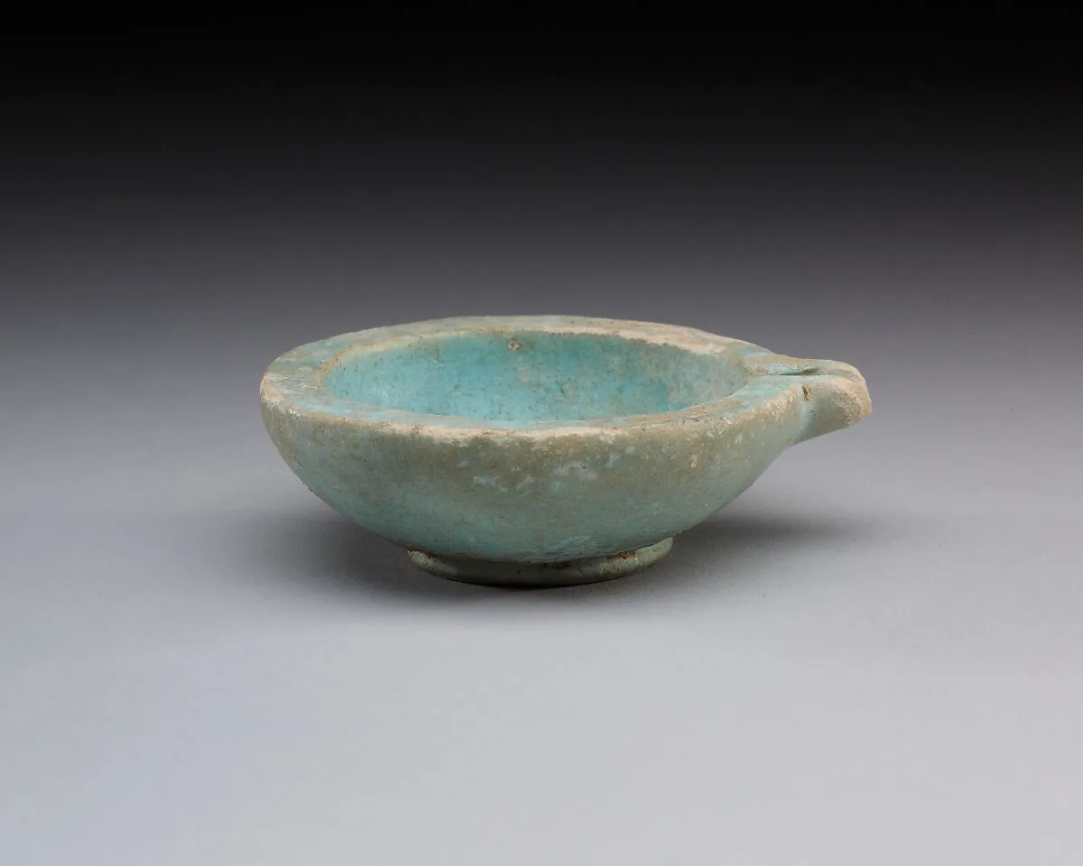 Spouted dish with rosette in the center, traces on the rim where two lions were attached — Unknown