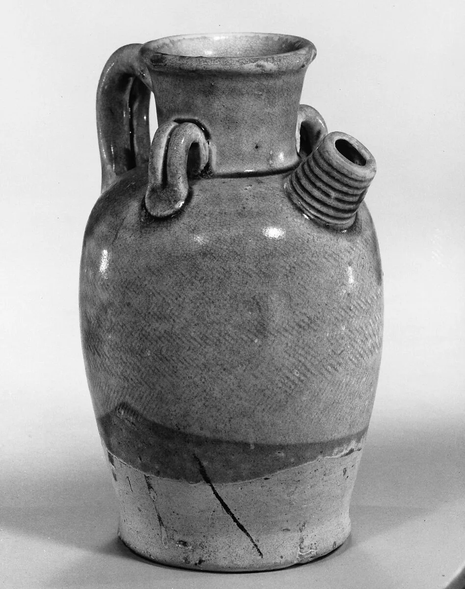 唐 黄釉瓷壶|Ewer with loop handles — Unknown