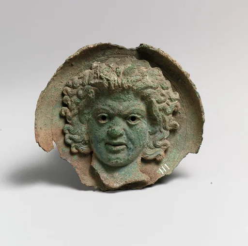Silvered bronze roundel with satyr head (one of a pair)