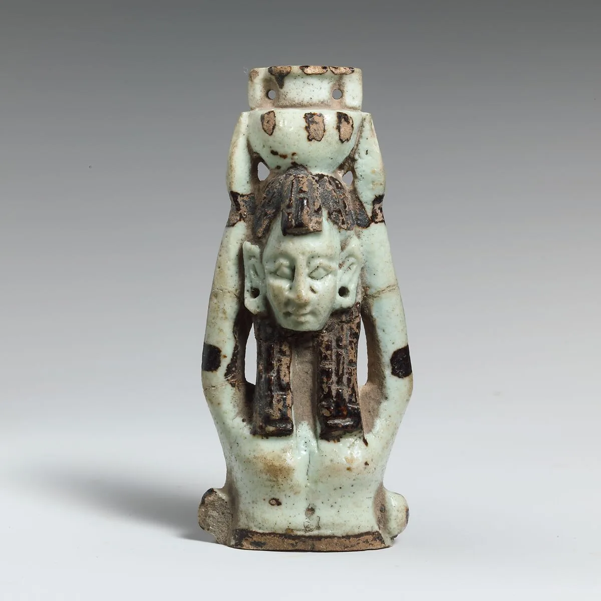 Fragment of a faience statuette of a woman holding a vase on her head — Unknown
