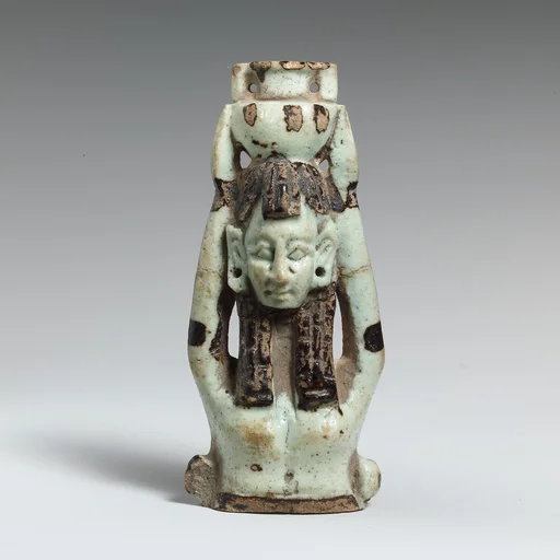 Fragment of a faience statuette of a woman holding a vase on her head