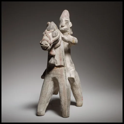 Horse and rider figurine