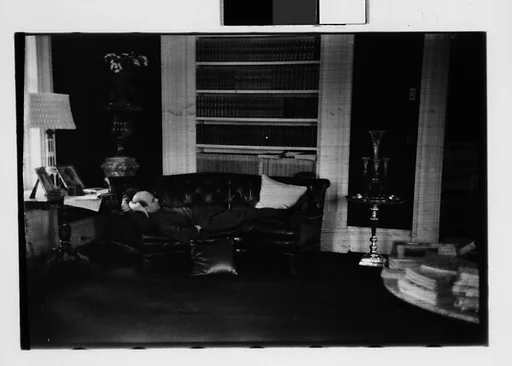 [Five 35mm Film Frames: Gifford Cochran Lying on Couch in Library, Croton Falls, New York]