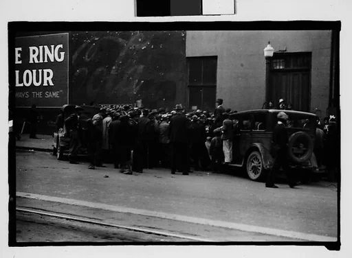 [Crowd Listening to Speaker Standing on Car Fender, Milledgeville, Georgia]