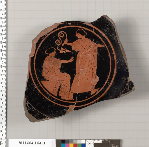 Terracotta fragment of a stemless kylix (drinking cup)
