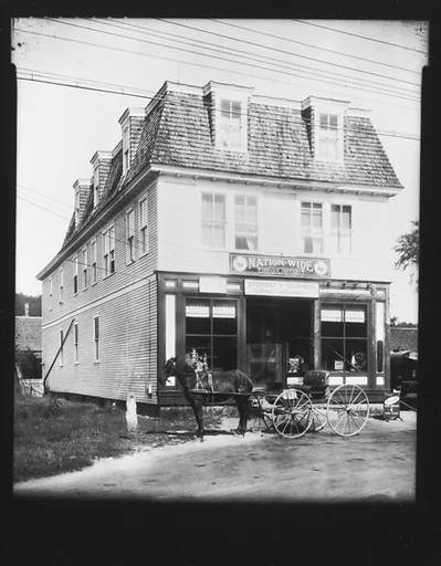 [Horse-Drawn Carriage in Front of General Store and Post Office, Plainfield, New Hampshire]