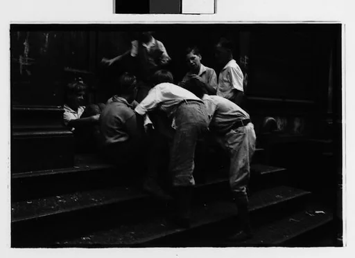 [Two 35mm Film Frames: Boys Playing on Stoop, New York City]