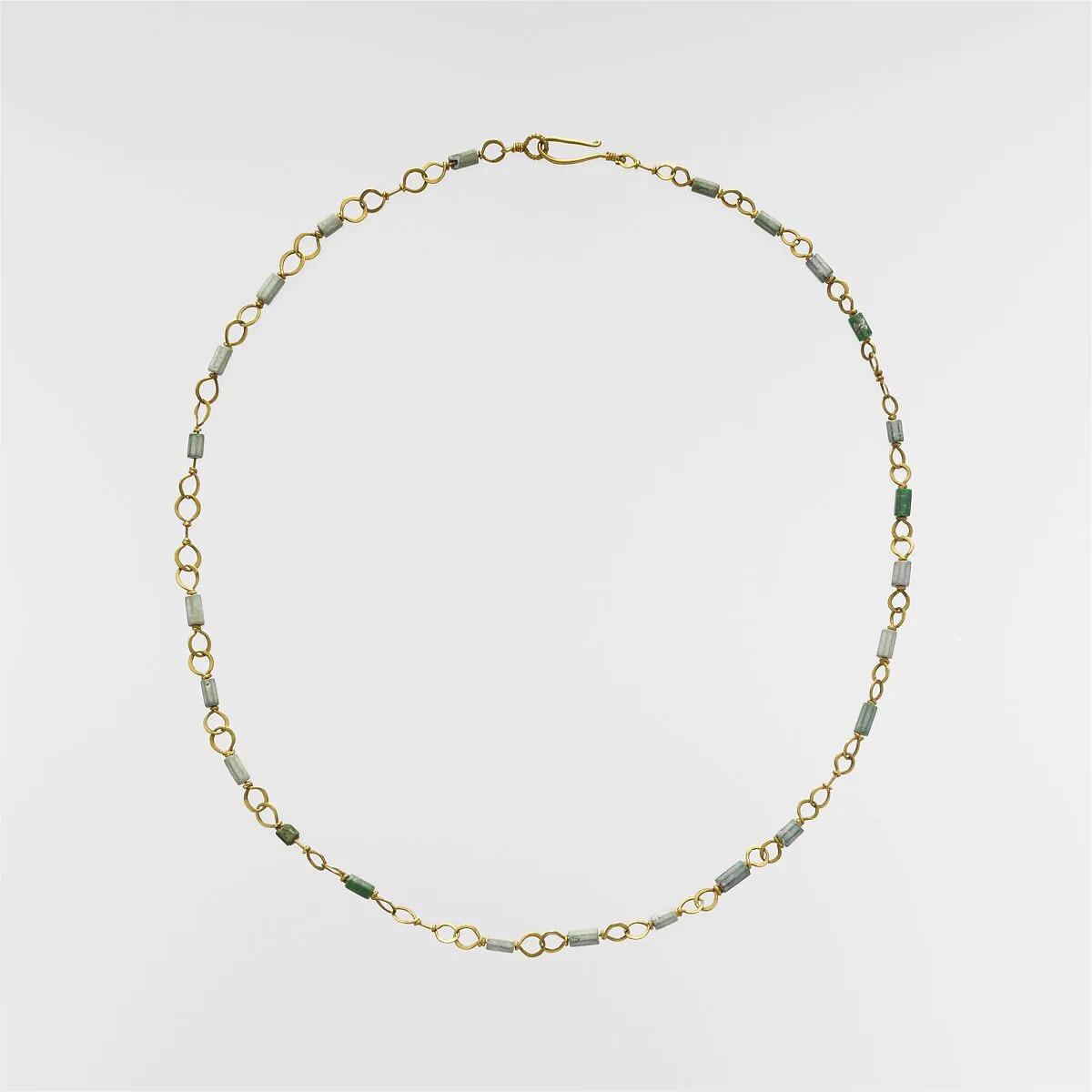 Gold necklace with emerald and variscite beads — Unknown