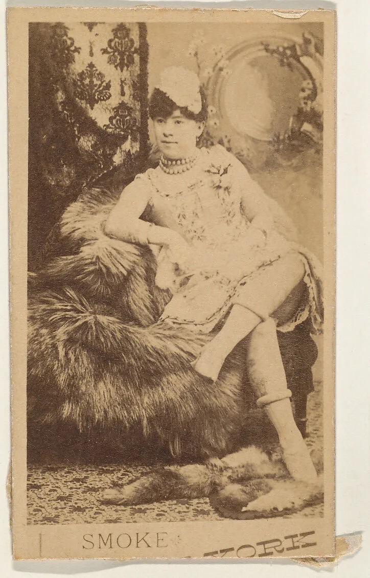Actress lounging on fur throw, from the series Actresses (N674), promoting New York Dandies — Unknown