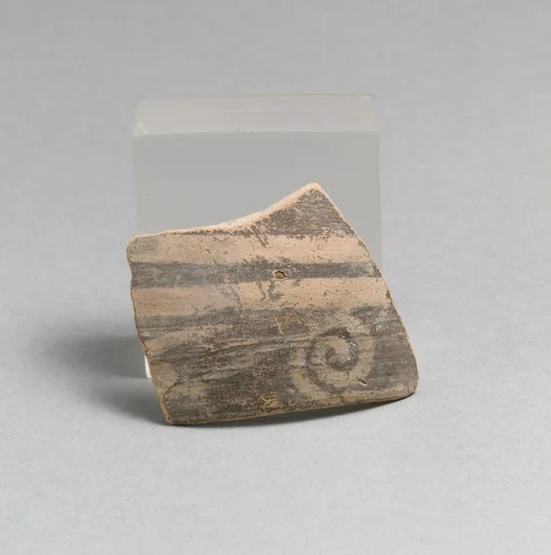 Terracotta rim fragment with running spiral